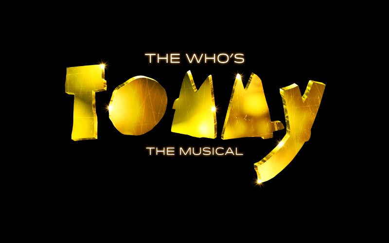 A golden logo that looks like shattered glass that reads "The Who's Tommy The Musical"
